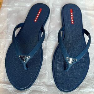 Prada rubber sport flip flops.